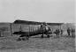 The first plane in The Pas: Biplane Avro 504-K in front of The Pas Lumber Co.