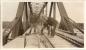 Men on railroad bridge over Nelson River.