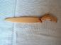 Wooden letter opener decorated with a leaping salmon, carved by Warren Gilker