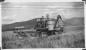 George Ramseier operating a 1941 Massey-Harris self-propelled combine, on his farm on Nick's Island.