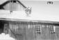 Al Pelkie and Milt Conley cleaning snow from barn roof.
