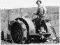 Milton Conley with steel wheeled tractor.