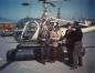 Four Men Stand by a Helicopter at Pacific Coast Terminals