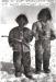 Two little boys playing with toy bows and arrows