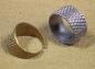 Two metal ring thimbles used by Kimiko Saito 