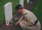 Cpl. Piercey places a poppy next to his uncle's grave at the Holten War Cemetary.