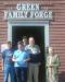 Presenting a gift to the 50,000th out of town visitor to the forge since opening in 1991.