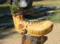 Flowerpot holding boot created by Chainsaw carver Mark Chasse