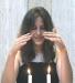 A Member of Temple's Youth Group (MOFTY) Lights the Shabbat Candles