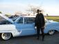 'Big' John 'T-Bone' Little - beside a Crown Victoria car
