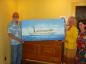 Bill Hartman donating painting of "The Mary Ward" to the Craigleith Heritage Depot.