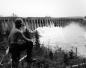 Worker looking at Main Dam, Grand Lake, 1962.