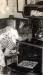 Effie Cook baking cinnamon buns in the Van Slyck Pioneer Home.