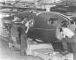 Men working on a Mosquito Bomber Fuselage