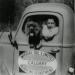 Fin Lineham with his pet dog Teddy in the Imperial Oil truck at Redwater, Alberta,