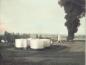 Unique colourized photo of oil tanks and burning pit on a farm near Redwater