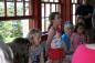 Children from Barra, Scotland visit the Highland Village