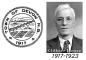 Town of Devon Seal and Mayor Gilbert Henry
