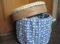 Cheese box was covered  with fabric to make a stool  and  storage container..