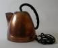 A copper electric kettle manufactured by Westinghouse.