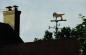 Dog weather vane adorning a local house, made by Warren Gilker in his blacksmith shop
