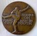 Bronze medallion entitled 'Strength and Speed'. 