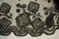 Black tamboured lace used for clothing or edging of table linens