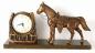 Coppertone finish horse/horseshoe clock, dark wood base, Snider Clock Corporation (windup movement).