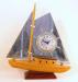 Single-mast, flat-sails electric boat clock with cabin light, Snider Clock Corporation.