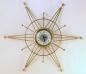 A third early starburst electric wall clock, Snider Clock Mfg Co.