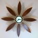 Another large, flower-style, starburst electric clock, Snider Clock Mfg Co.