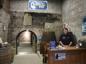 Interpreter Janine Sheppard in the entrance area of the warehouse section of the Newman Wine Vaults.