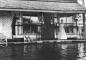 The York family in front of their store during a flood, circa 1909