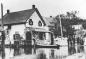 People beside the I. B. York House during flood, circa 1909