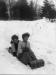 Two Girls Tobogganing - taken in Algonquin Park. Flo Sallows is on the back of the toboggan