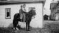 Robert and Howard Stoltz on their horse behind the garage on the Stoltz Centre Dyke Road farm