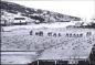 quipe de travail talant la morue sur les vigneaux  Battle Harbour (ca. 1900)