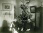 milie Dumont and Charles-Alfred Roy, known as Desjardins, in front of a Christmas tree